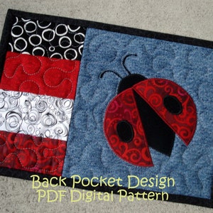 May include: A quilted fabric design featuring a ladybug and a patchwork section. The ladybug has red wings with a swirl pattern and black spots. The patchwork includes black and white circles, red swirls, and white swirls. The text "Back Pocket Design PDF Digital Pattern" is at the bottom.