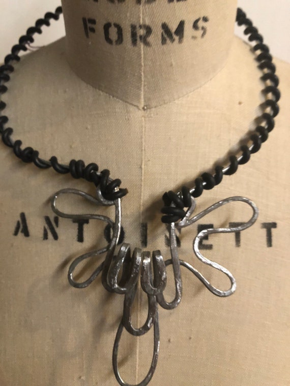 Metal wrapped collar black and silver art piece
