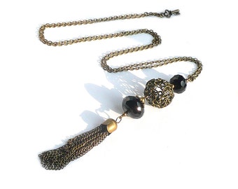 Long pendant necklace, pompom pendant, black beaded, bronze jewelry