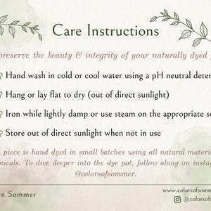 May include: A white informational card titled Care Instructions with green botanical illustrations. It lists steps for hand washing, drying, ironing, and storing naturally dyed items, noting they are hand dyed in small batches by Carolyn Sommer.