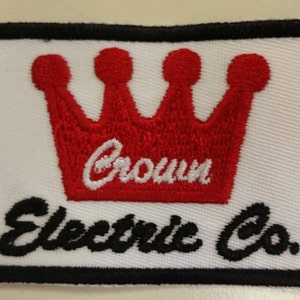 May include: White embroidered patch with a red crown and the text "Crown Electric Co."