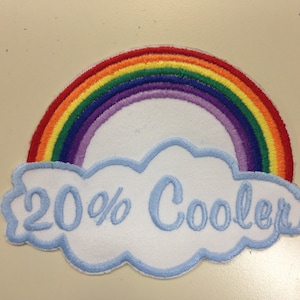 May include: A white embroidered patch with a rainbow arc above a blue cloud with the text "20% Cooler".