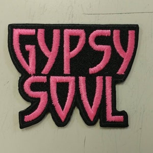 May include: Pink and black embroidered patch with the text "Gypsy Soul".
