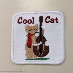 Cat strumming bass embroidery design