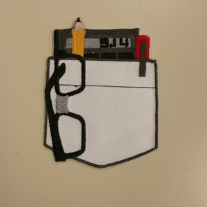 May include: An embroidered patch depicting a pocket with a pencil, calculator, and glasses sticking out. The calculator display shows "3.14".