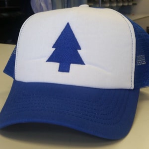 May include: A blue and white trucker hat featuring a blue pine tree graphic on the front. The hat has a white front panel, a blue brim, and a blue mesh back. The hat is a classic style, suitable for casual wear.