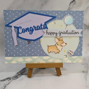 Handgemaakte gelaagde afstuderenkaart - gefeliciteerd - Corgi hond met ballongradatie - kwastje - diploma mortelbord