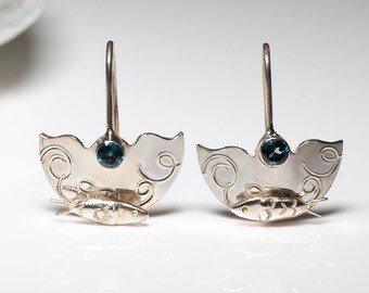 Sterling silver fish earrings with sea blue topaz