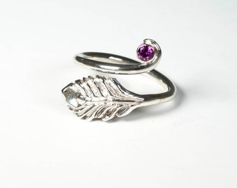 Peacock feather ring with rhodalite garnet. Sterling Silver. Open wrap around ring.