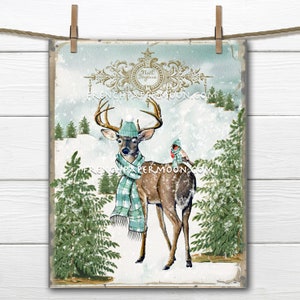 Puede incluir: Una tarjeta de Navidad de estilo vintage con un ciervo que lleva una bufanda de cuadros azules y blancos y un gorro azul. El ciervo est&aacute; de pie en un bosque nevado con un peque&ntilde;o p&aacute;jaro rojo posado en su espalda. La tarjeta tiene un borde dorado y blanco adornado con el texto "No&euml;l Joyeux" en el centro.