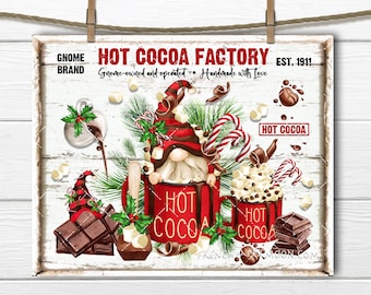 May include: A white sign with red text that reads "Gnome Brand Hot Cocoa Factory Est. 1911 Gnome-owned and operated. Handmade with Love." The sign features a cartoon gnome wearing a red hat and holding a red mug of hot cocoa. There are marshmallows, chocolate, and candy canes around the gnome.