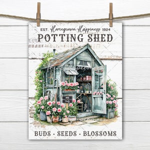 May include: A watercolour print of a potting shed with the text "Homegrown Happiness" and "Potting Shed." The shed is light blue with pink roses in pots and climbing the walls. The words "Buds, Seeds, Blossoms" are at the bottom.