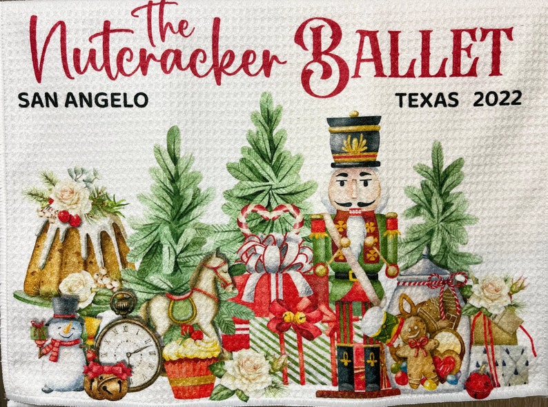 May include: A white background with the text "The Nutcracker Ballet" in red letters. The text "San Angelo Texas 2022" is below the title. The image features a nutcracker soldier, a gingerbread man, a rocking horse, a clock, a snowman, a cake, and presents. The image is decorated with green pine branches, white flowers, and red candy canes.