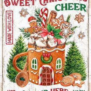 May include: A vintage-style sign with a gingerbread house mug filled with marshmallows, candy canes, and cinnamon sticks. The sign reads "Sweet Christmas Cheer" and "Served Here" with "Hot Cocoa" and "Warm Cookies" at the bottom.