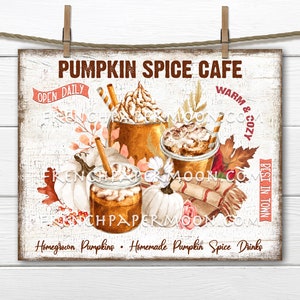 May include: A white sign with brown text that reads "Pumpkin Spice Cafe" with a fall theme. The sign features three glasses of pumpkin spice drinks with whipped cream and cinnamon. The sign also says "Open Daily" and "Warm & Cozy Best in Town".