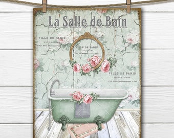 May include: A vintage-style bathroom sign with the text "La Salle de Bain" in French. The sign features a green bathtub with a pink rug and floral accents on a distressed white background.