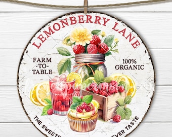 May include: Round, distressed white sign with the text "Lemonberry Lane" in red. The sign features illustrations of raspberries, lemons, a cupcake, and a glass of raspberry lemonade. The text "Farm-to-Table" and "100% Organic" are also included.