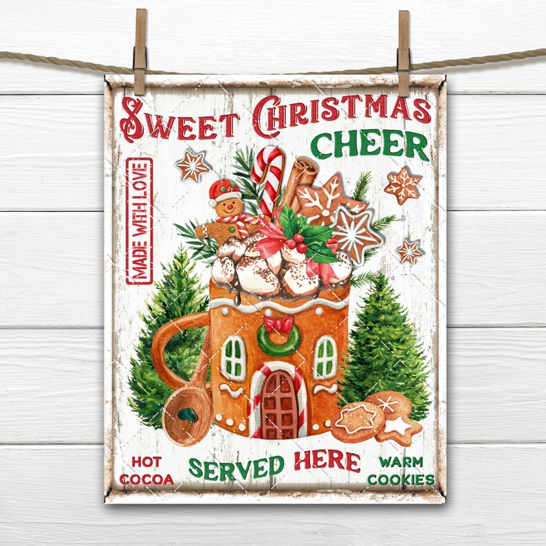 May include: A vintage-style sign with a gingerbread house mug filled with hot cocoa, marshmallows, candy canes, and cookies. The sign reads "Sweet Christmas Cheer" and "Served Here".