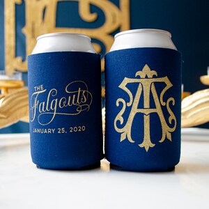 May include: Two blue and white can coolers with gold lettering. One cooler says "The Falgouts" and "January 25, 2020". The other cooler has a gold monogram with the letters "A" and "S".