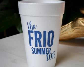 May include: A white styrofoam cup featuring blue text that reads the FRIO SUMMER 2018. The cup has a tapered cylindrical shape with a smooth rim and a textured surface typical of expanded polystyrene foam material used for beverage containers.