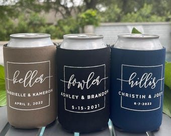May include: Three foam can coolers in tan, black, and navy blue. Each features a white square outline with a custom surname in script, followed by two first names and a date. The text reads Keller, Fowler, and Hillis with dates.