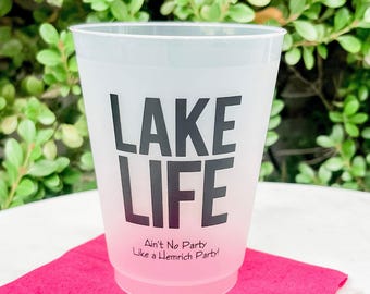 May include: A translucent frosted plastic cup featuring the black text LAKE LIFE in a bold sans-serif font, with the smaller black text Ain't No Party Like a Hemrich Party! printed underneath in a simple, clean, and legible typeface.
