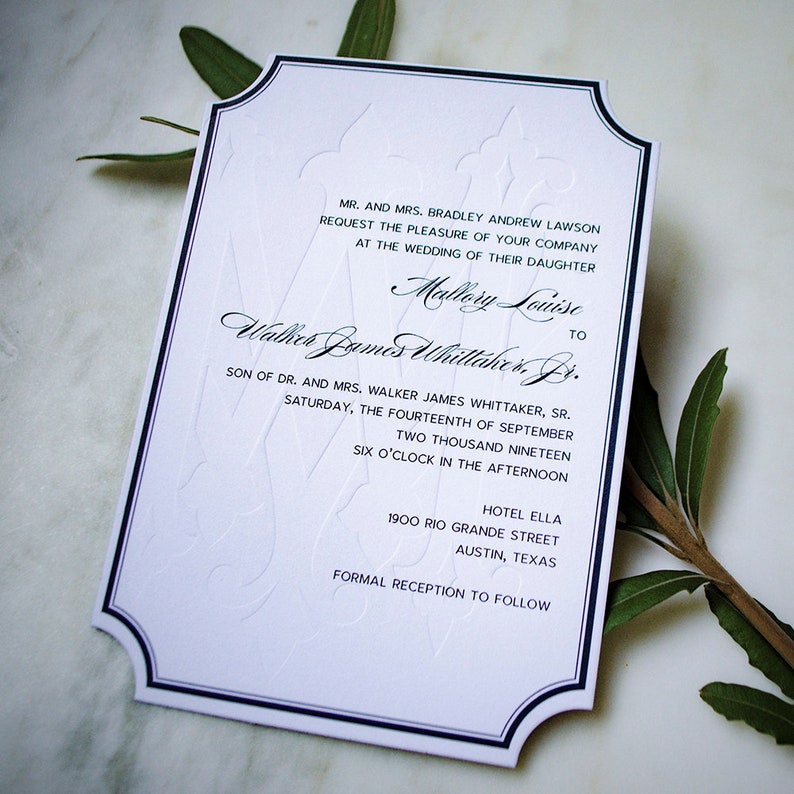 May include: A white wedding invitation with black and blue trim. The invitation announces the wedding of Mallory Louise to Walter James Whittaker Jr. The wedding will take place on Saturday, September 14, 2019 at 6:00 PM at the Hotel Ella in Austin, Texas.