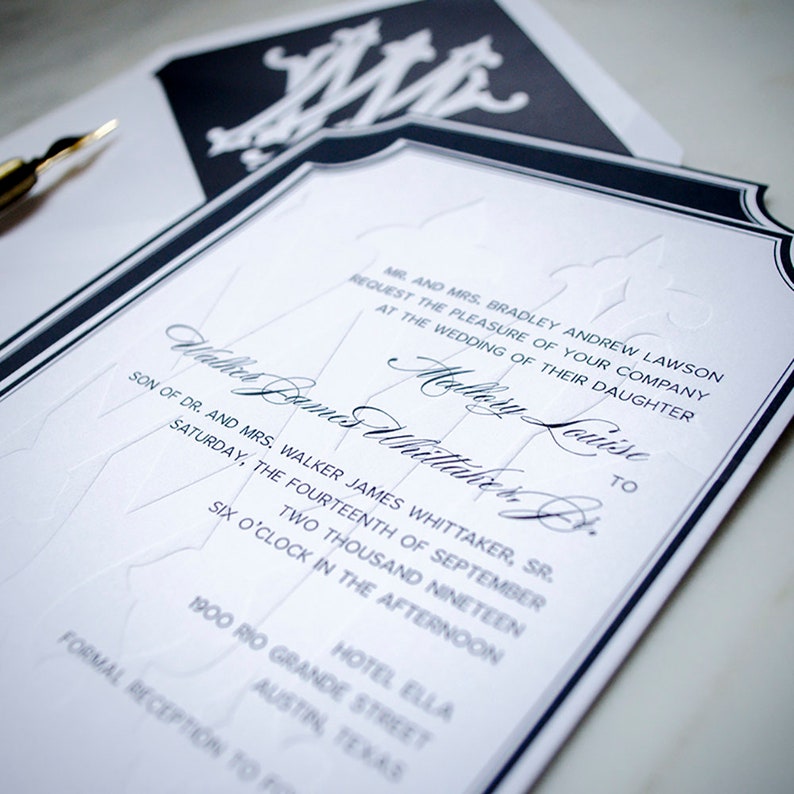 May include: A white wedding invitation with black trim and a black and white monogram. The invitation reads "Mr. and Mrs. Bradley Andrew Lawson request the pleasure of your company at the wedding of their daughter Mallory Louise to Walter James Whittaker, Jr. Son of Dr. and Mrs. Walker James Whittaker, Sr. Saturday, the fourteenth of September two thousand nineteen six o'clock in the afternoon Hotel Ella 1900 Rio Grande Street Austin, Texas Formal Reception to follow."