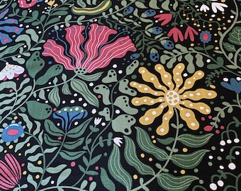 May include: A black fabric with a repeating pattern of stylized flowers, leaves, and geometric shapes in shades of green, yellow, pink, blue, and white.