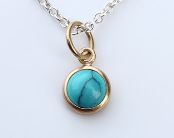 Pendant with turquoise in 750 yellow gold