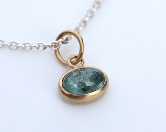 Pendant made of 750 yellow gold and 935 silver with tourmaline oval