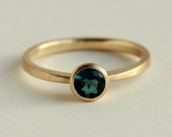 750 gold ring with round indicolite