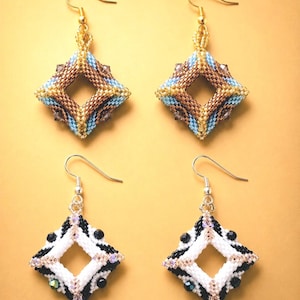May include: Four pairs of handmade beaded earrings. Two pairs feature a diamond shape with brown, gold, and blue beads. The other two pairs have a diamond shape with black, white, and iridescent beads. All earrings have a hook closure.