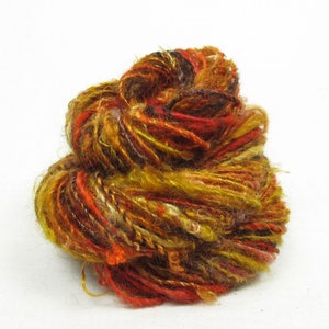 Handspun Single, from Kid Mohair dyed shades of brown, gold and red with banana silk add-ins