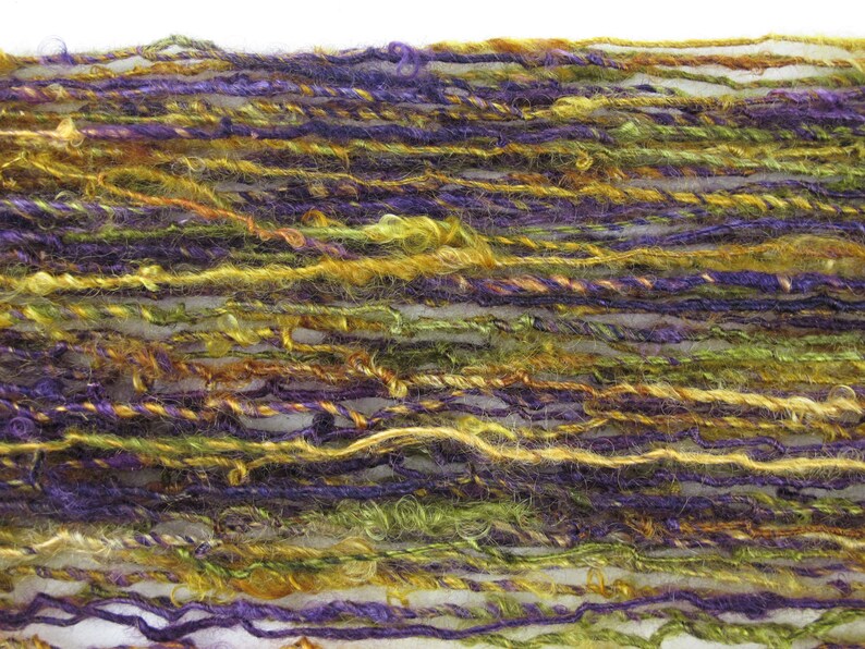 green and gold from Kid Mohair dyed in shades of purple Handspun Single