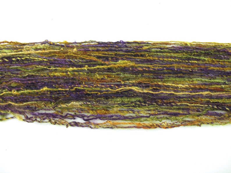 green and gold from Kid Mohair dyed in shades of purple Handspun Single