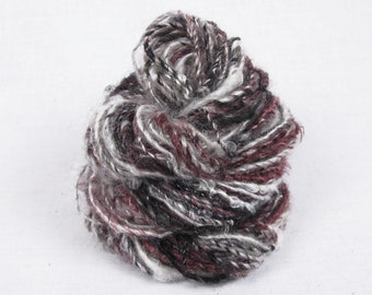 Handspun Single from Locks of 2nd Clip Kid Mohair hand dyed in shades of black, brown with natural.