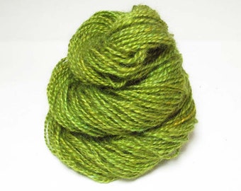 Handspun 2 ply from kid mohair locks and tussah silk, in shades of green.