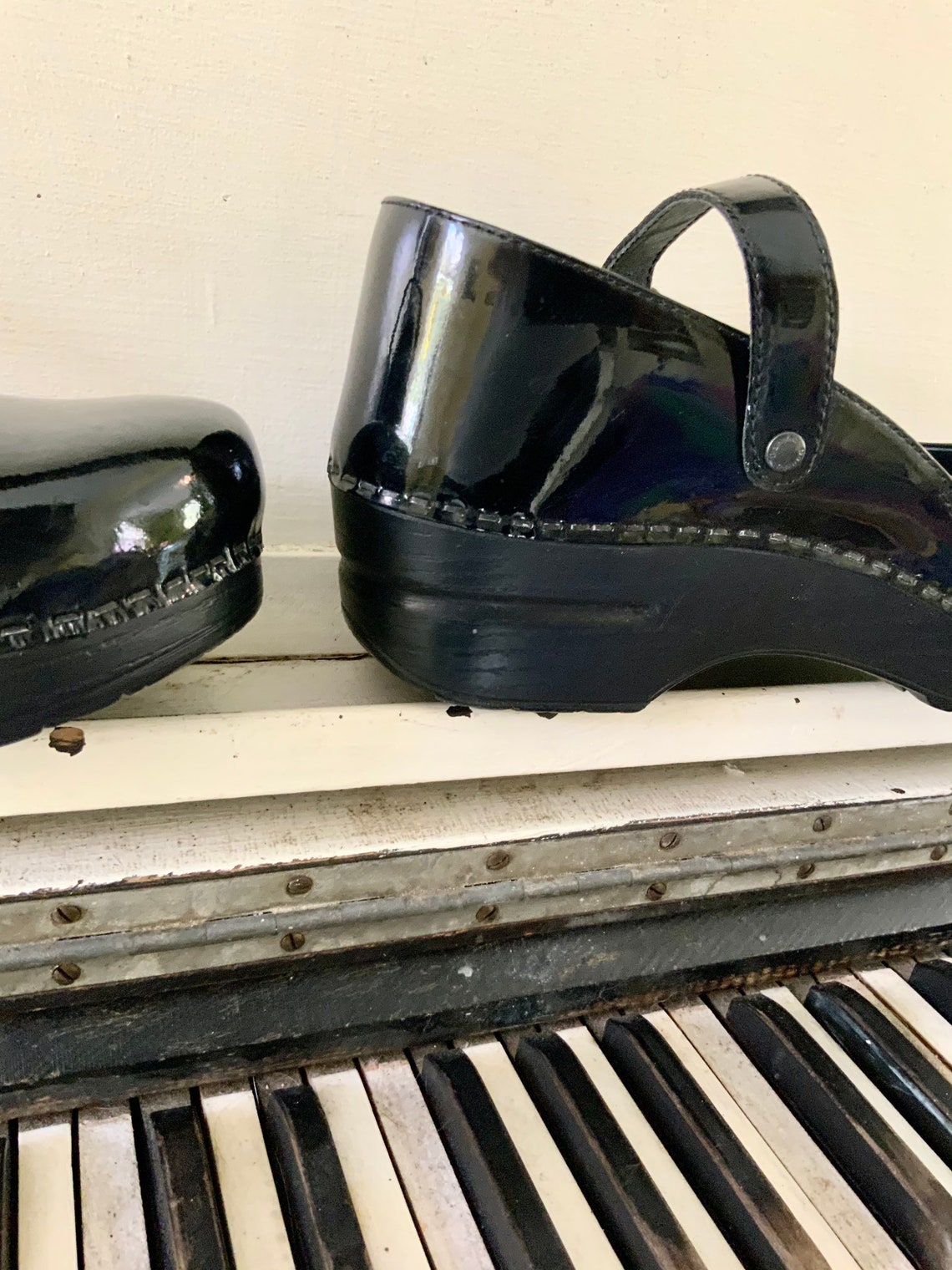 dansko black patent leather clogs