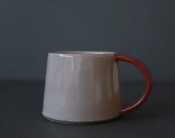 Stoneware cup in blush pink and dark red colour block