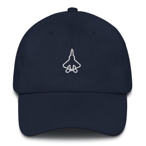 May include: A navy blue baseball cap with a white embroidered outline of a fighter jet.