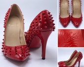 CHRISTIAN LOUBOUTIN Size 38 7.5 Red Spiked Leather Pumps