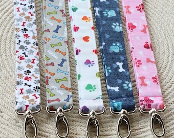 Dog paw themed fabric lanyards with multiple lengths available.  Handmade fabric dog themed lanyards for ID's, Badges, cruises, keys