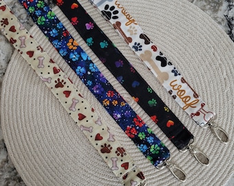 Dog themed fabric lanyards with a metal lobster swivel clap.  ID badge, Key holder, Badge holder, ticket holder, back stage passes, Woof