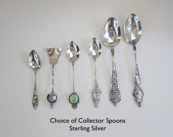 May include: A collection of six sterling silver collector spoons. The spoons feature various designs and are displayed on a white background.  Choice of Collector Spoons Sterling Silver