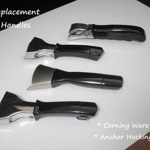 May include: Four replacement handles for cookware. The handles are black with a silver metal attachment. The handles are arranged in a row from top to bottom. The text "Replacement Handles" is visible at the top of the image. The text "* Corning Ware * Anchor Hocking" is visible at the bottom of the image.