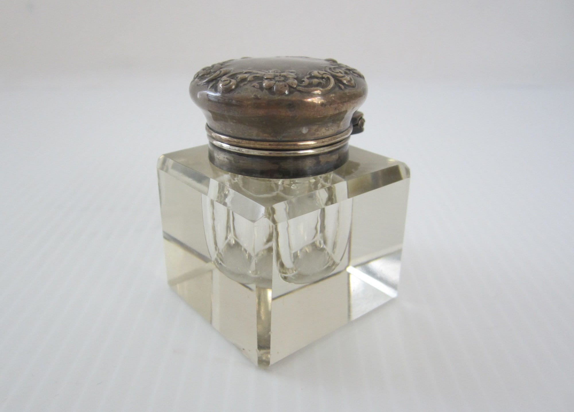 Triangular inkwell made of glass and pewter with a Lily Flower.
