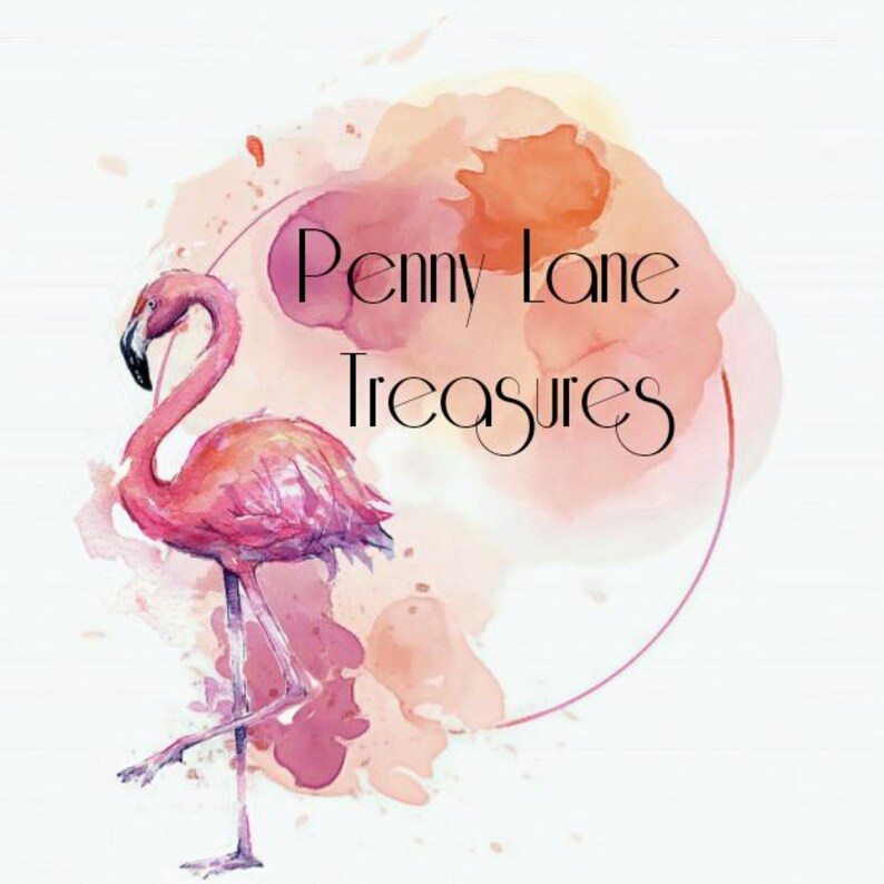 May include: A logo design featuring a pink flamingo standing on one leg, positioned to the left of a soft, watercolor-style splash in shades of peach and pink. The text Penny Lane Treasures is written in a black, elegant, thin serif font.