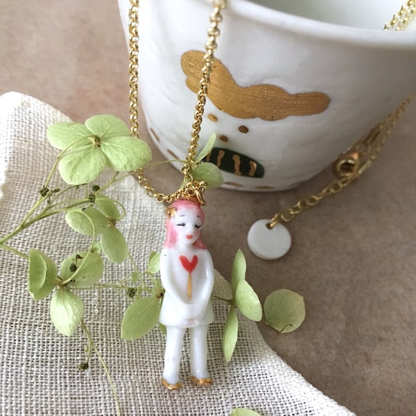 Very tiny  porcelain doll necklace with pink hair and real gold details,  named Love