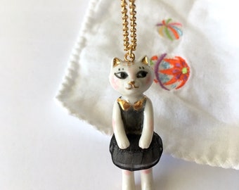 Cat doll porcelain necklace dressed in black called Neko with real gold details